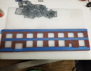 20180321 063251  After spray painting walls and applying Roberts Brick Mortar wash.  Masking to paint the window sills/foundation.